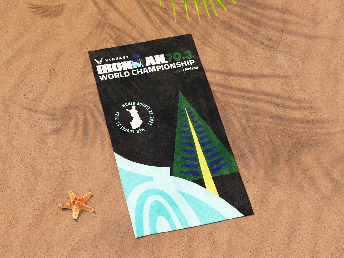 Ironman beach towel staged on a beach, warm lifestyle CGI frame